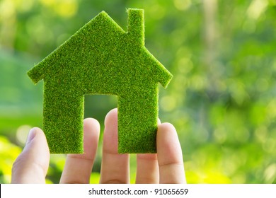 hand holding eco house icon concept - Shutterstock ID 91065659