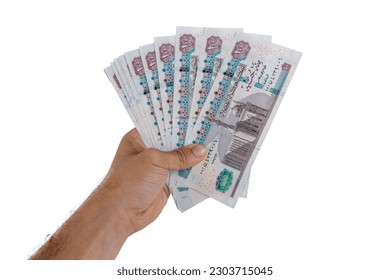 hand holding Egyptian money isolated on white background - Shutterstock ID 2303715045