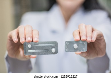 A Hand Holding Emergency Contraception (morning After Pill) Packs.