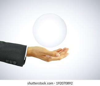 Hand holding empty transparent bubble - can be used as copy space for text or objects