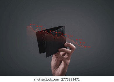 Hand holding empty wallet with declining financial graph overlay. Concept of financial crisis, economic recession, personal debt, budget shortage, investment loss and business financial downturn.