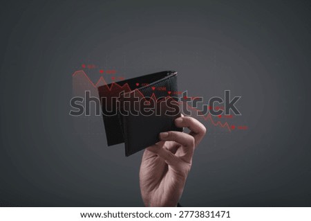 Hand holding empty wallet with declining financial graph overlay. Concept of financial crisis, economic recession, personal debt, budget shortage, investment loss and business financial downturn.