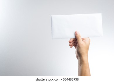 Hand Holding Envelope On White Background