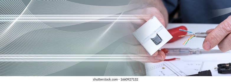 Hand Holding An Ethernet Outlet And A Cable; Panoramic Banner