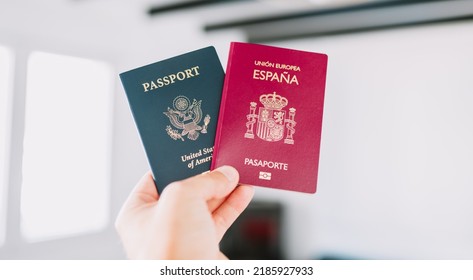 Hand Holding A European And American Passports.
