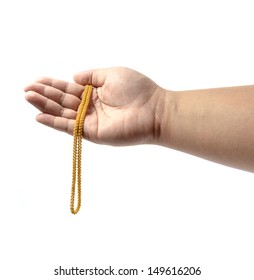 Hand Holding Expensive Gold Jewelry On White Background