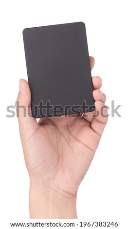 Hand holding External harddisk SSD isolated on white background.
