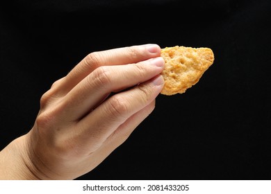 Hand Holding The Fast Food In Front Of Black Ground