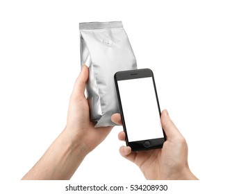 Hand Holding Foil Coffee Bag And Mobile Phone Smartphone Isolated On White Background. NFC Packaging Template Mockup Collection. With Clipping Path Included.