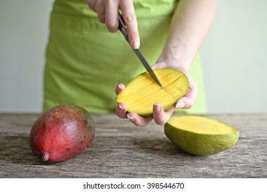 Hand Holding Fresh Mango , Cut in Square Shape Concept of Food Art, Idea of Decorated Food - Powered by Shutterstock