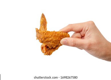 Hand Holding Fried Chicken Wing.