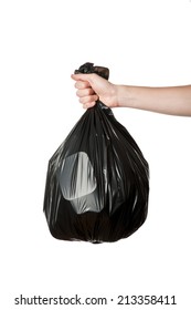 Hand Holding A Full Black Plastic Trash Bag