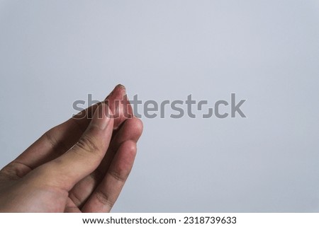 hand holding Garlic isolated on white background. The concept of the use of garlic and healthy eating