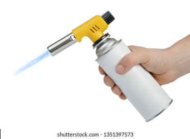 Hand holding gas can with manual torch burner (blowtorch) with blue flame isolated on white background. Serie of tools.