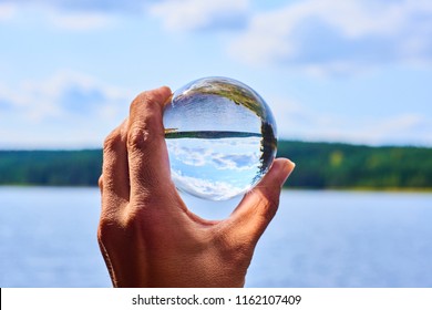 Hand Holding Glass Ball Reflecting Lake Stock Photo (Edit Now) 1162107409