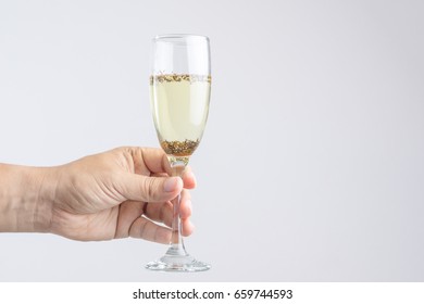 Hand Holding Glass Of Champagne With Pest Or Insect On White Background