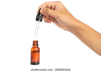  Hand Holding Glass Pipette Essential Oils Bottle Isolated On White Background