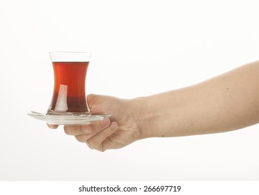 Hand Holding A Glass Of Turkish Tea On White