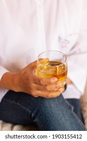 Woman’s Hand Holding A Glass Of Wiskey