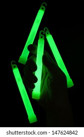 A Hand Holding Glow Stick