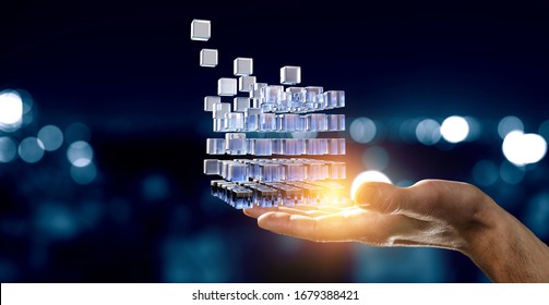 Hand holding glowing cubes. Innovation and creativity concept. - Shutterstock ID 1679388421
