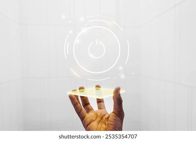 Hand holding a glowing digital interface against white wall. Futuristic technology concept with a glowing interface. Digital interface and technology in focus. - Powered by Shutterstock