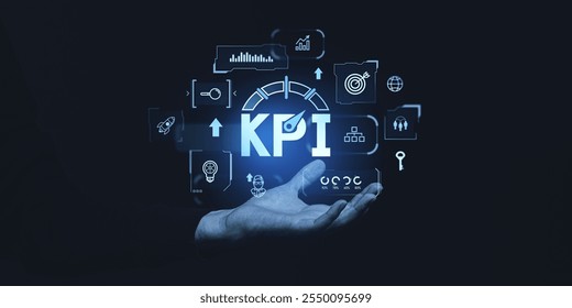 Hand holding glowing KPI icons, representing business strategy, graphs, and metrics. Futuristic interface on dark background. Concept of performance - Powered by Shutterstock - Get 15% off with code: PIKWIZARD15