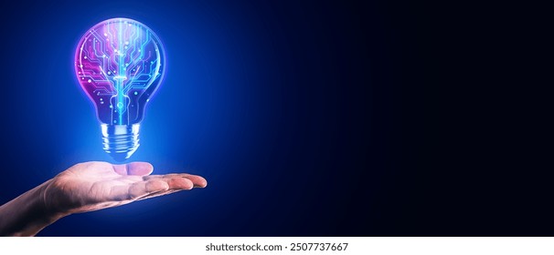 A hand holding a glowing lightbulb with a digital circuit inside, set against a dark blue background. Concept of technology and innovation - Powered by Shutterstock