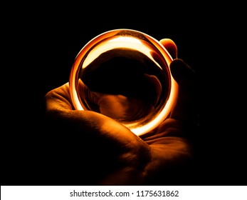 Hand Holding Glowing Orb