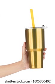 Hand Holding Gold Yeti Cup With Tube Isolated On White Background.