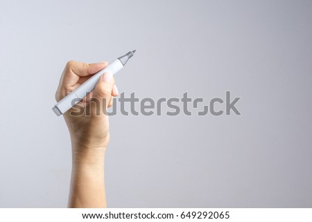 Hand holding gradient level adjustment permanent marker on white background