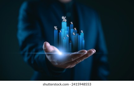 Hand holding graph with percentage, special offer of shopping department store discount and tax concept, adjusting interest rates, raising interest rates to fight inflation, returns on investments. - Powered by Shutterstock