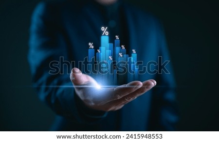 Hand holding graph with percentage, special offer of shopping department store discount and tax concept, adjusting interest rates, raising interest rates to fight inflation, returns on investments.