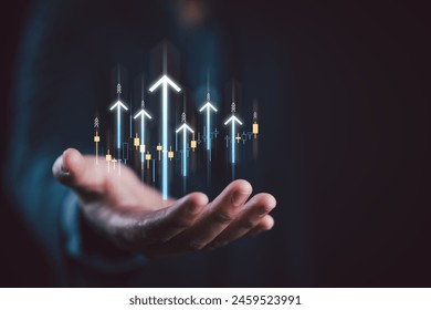 Hand holding growth business strategy arrow concept on success target improvement with increase development graph profit or economy investment income target and goal increase achievement.