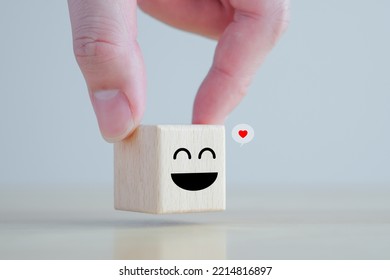 Hand Holding Happy Face And Heart Icon On Speech Bubble For Positive Thinking, Feedback, Emotion, Satisfaction, Customer Service Review, Mental Health Assessment, World Mental Health Day Concept.