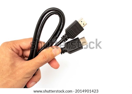 hand holding hdmi cable on white background