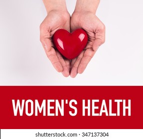 Hand Holding Heart Shape With WOMEN'S HEALTH Text