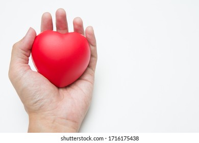 The Hand Is Holding Heart Shaped Squeeze Ball For Hand Muscle Exercise On White Background And Copy Space