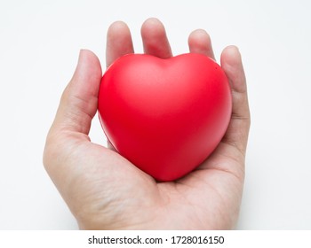 The Hand Is Holding Heart Shaped Squeeze Ball For Hand Muscle Exercise On White Background And Copy Space