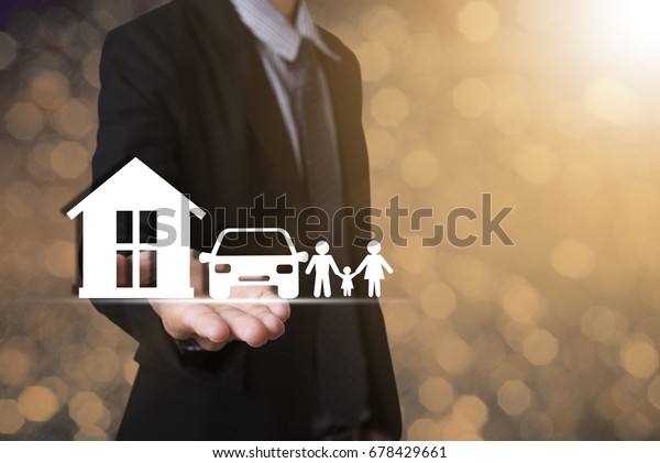 hand holding home car family. concept\
assurance health-care\
insurance.