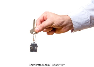 Hand Holding House Keys On White Background