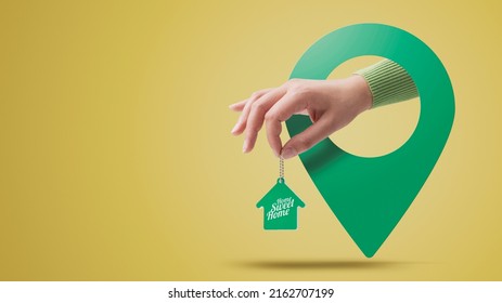 Hand Holding House Shaped Keychain And Location Pin, Real Estate Concept