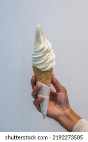 Hand holding ice cream cone - Shutterstock ID 2192273505