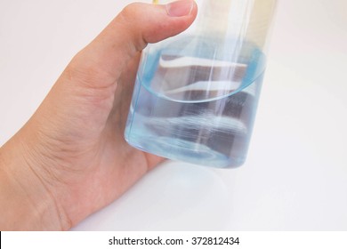 Hand Holding An Isopropyl Alcohol Bottle