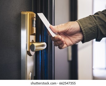 Hand Holding Key card Hotel room access 