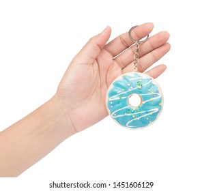 Hand Holding Key Chain Donut Isolated On White Background.