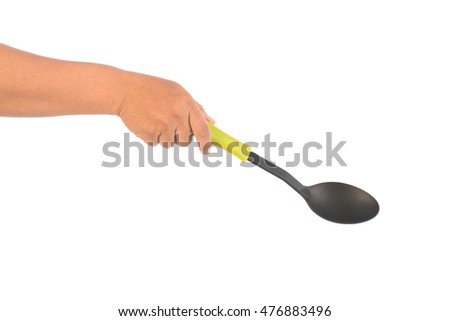 hand holding kitchen utensils on white ,selective focus