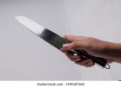 The Hand Is Holding The Knife