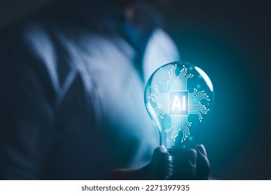 hand holding a light bulb. artificial intelligence or AI of future innovation technology concept, applying technology to business in the digital age. empowering global business AI. - Powered by Shutterstock