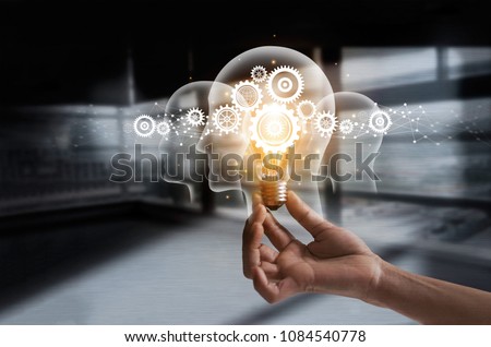 Hand holding light bulb and cog inside. Idea and imagination. Creative and inspiration. Innovation gears icon with network connection on metal texture background. Innovative technology industrial.